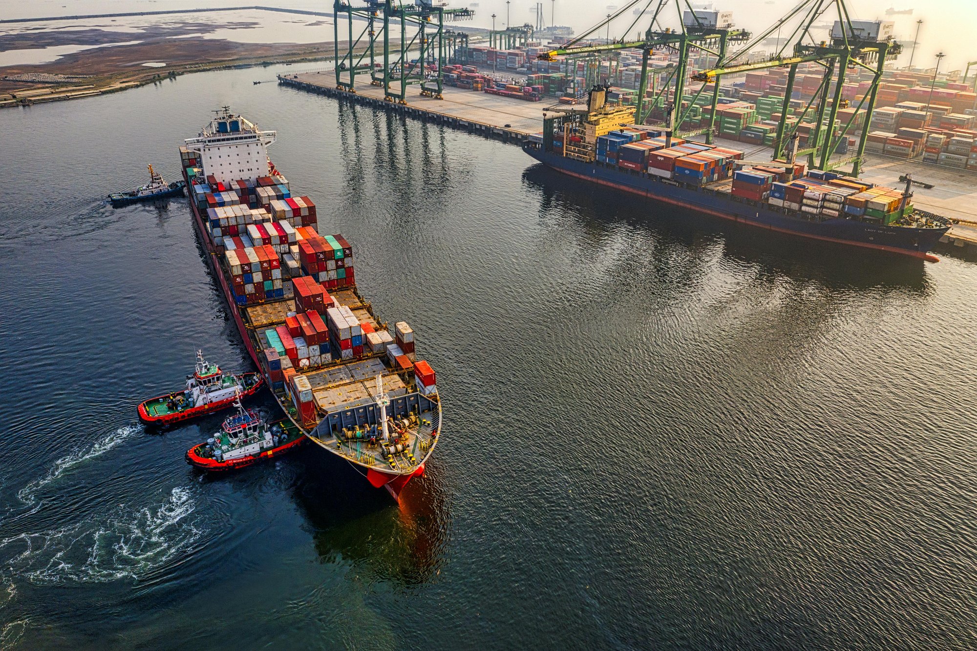Container ship being loaded at port — Fair T7.
